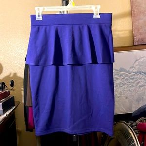 Medium, blue skirt.
